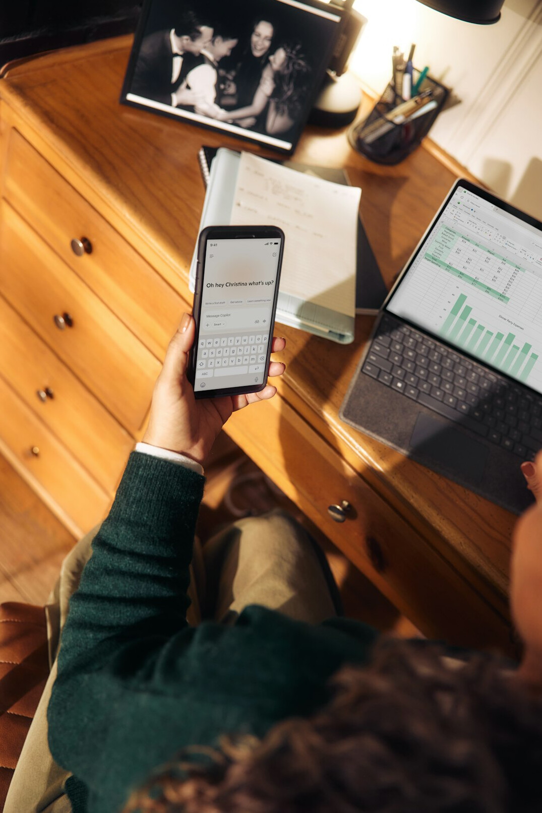 person sorting green folders on desk